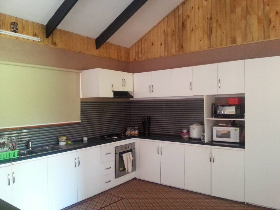Deluxe Villa | Private kitchen | Full-size fridge, microwave, oven, stovetop