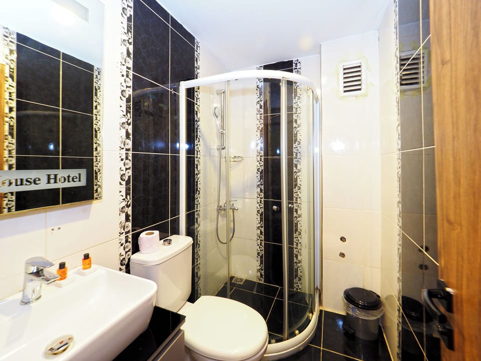 Shower, free toiletries, hair dryer, slippers