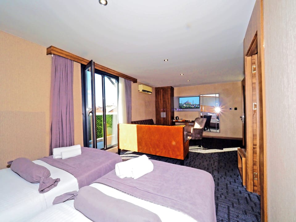 Family Room | Premium bedding, down comforters, minibar, desk
