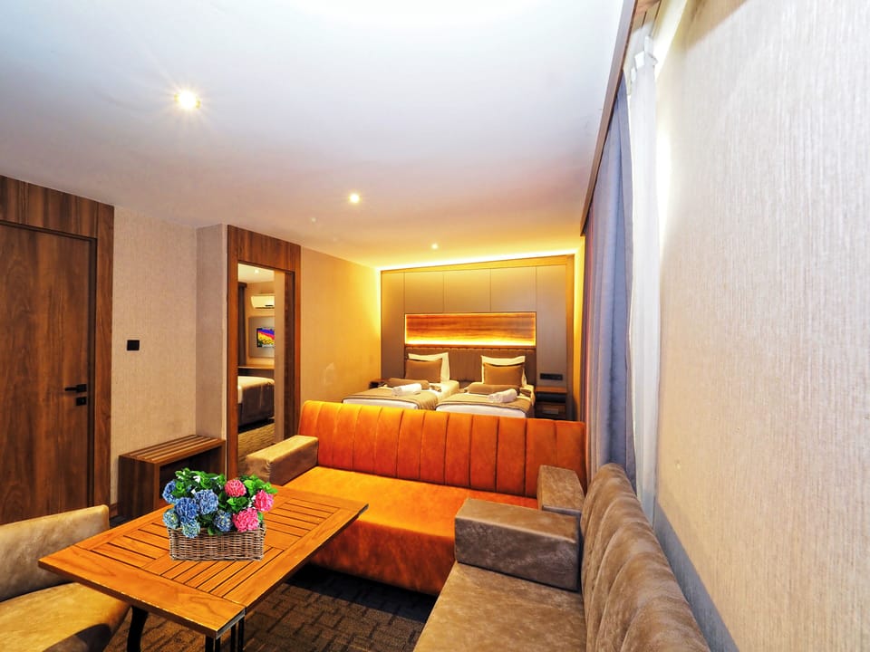 Family Room | Premium bedding, down comforters, minibar, desk