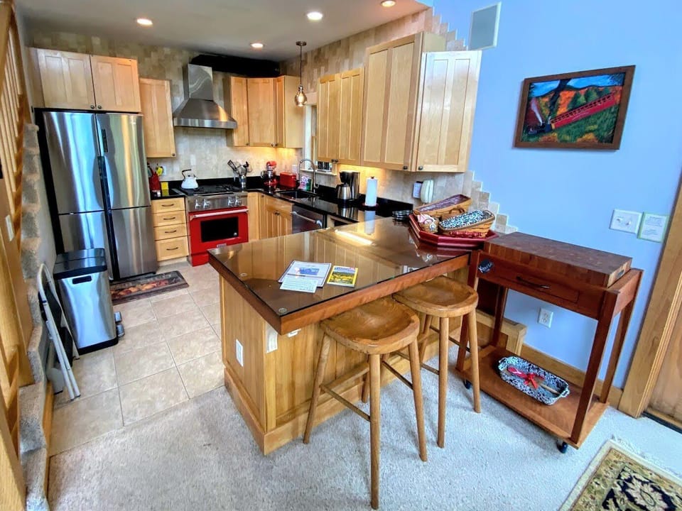 The open-concept kitchen boasts stainless steel appliances, granite countertops, and everything you need to prepare a home-cooked meal.