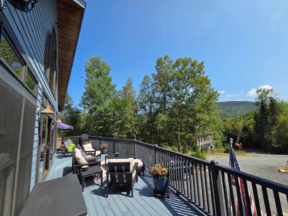 Step out onto the expansive deck to soak in the scenery, or unwind in the hot tub after a day of adventure.