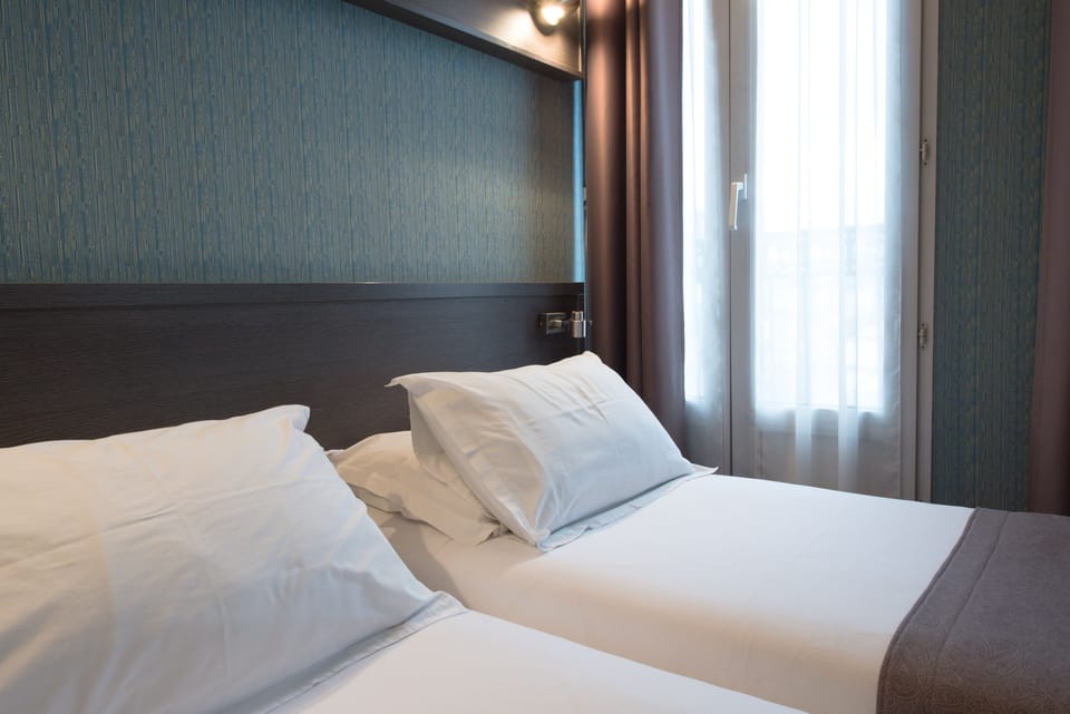Twin Room | Minibar, in-room safe, desk, soundproofing