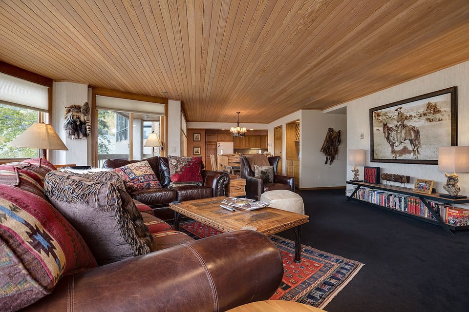 Sink into rich leather seating surrounded by warm wood and Western charm, where your mountain retreat feels like home.