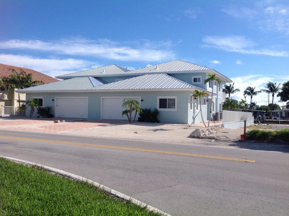 Front of duplex,  double car garage.