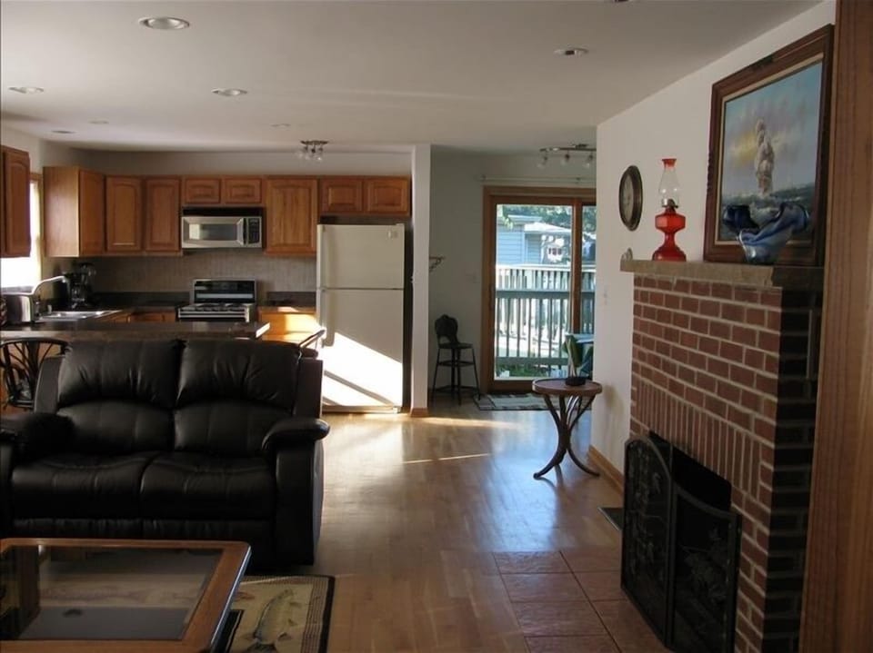 Straight view across the room showing the view of the deck and lake.