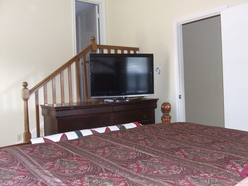 master bedroom, stairs lead to master bathroom
