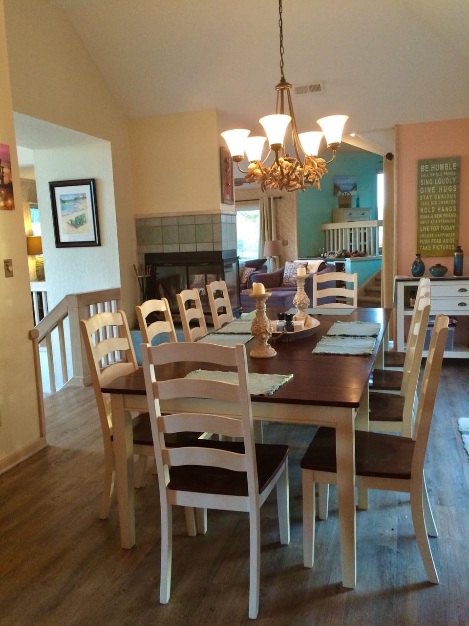 Dining area opens to triple slider with deck and screened porch