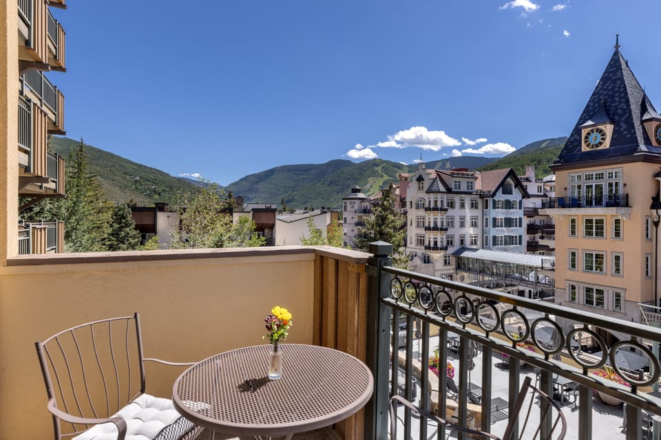 Step out onto your private balcony and breathe in the crisp alpine air. Rolling mountains, charming village rooftops, and endless blue skies create a postcard-perfect backdrop for morning coffee or evening relaxation.