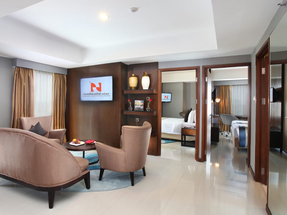 Family Room, 2 Bedrooms | Minibar, in-room safe, desk, blackout drapes