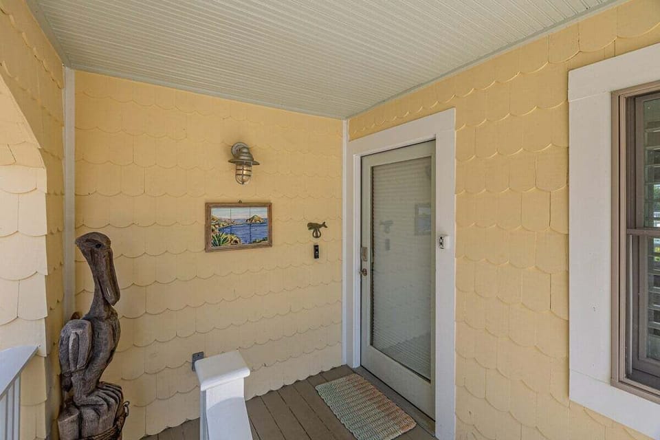Entrance to the property with coastal decor