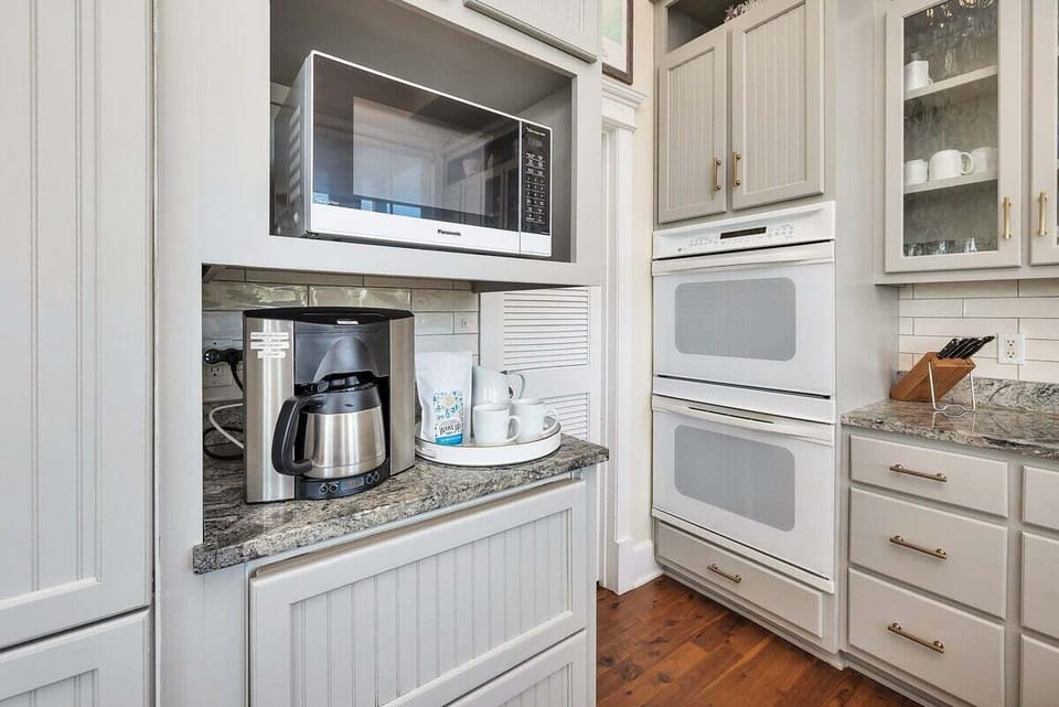 Close-up of the coffee and microwave in kitchen