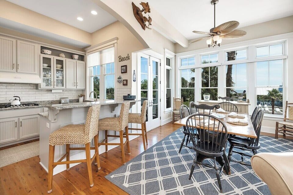 Open-concept kitchen and dining area with large windows