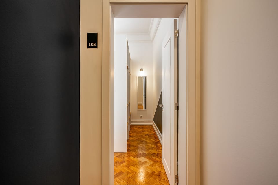 Deluxe Suite, Private Bathroom | Desk, laptop workspace, blackout drapes, iron/ironing board