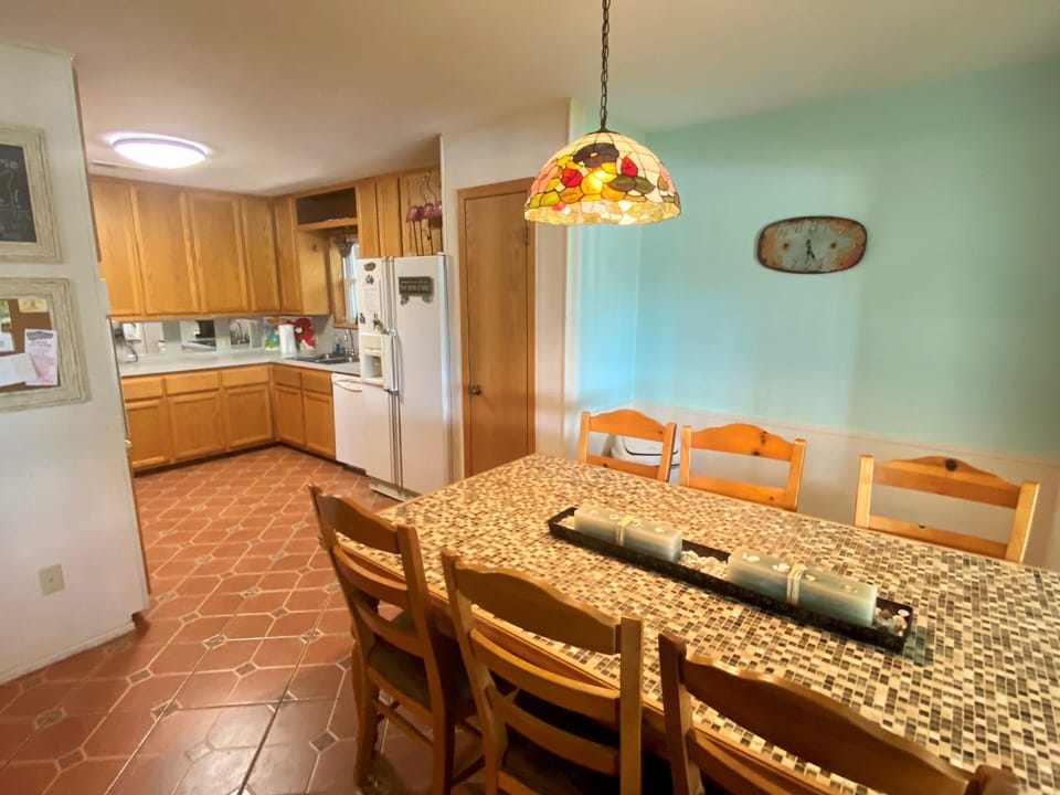 Open dining that seats 6 and fully stocked kitchen.
