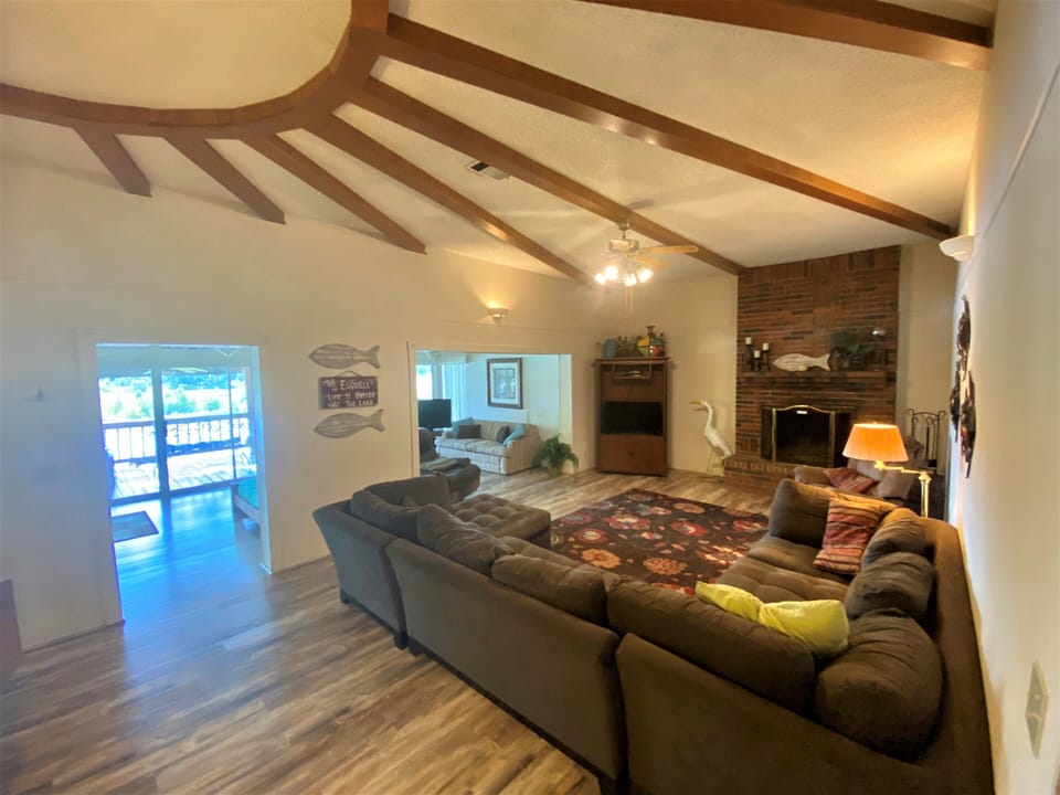 Another view of family room and adjacent sun-room with panoramic water view.