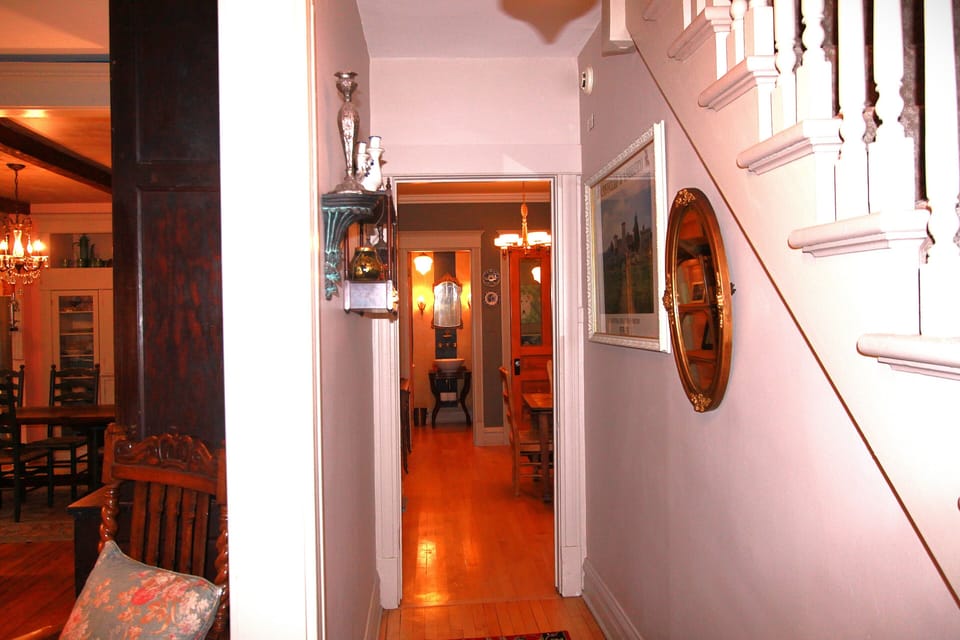Staircase and hall way to the library. People love the separate, formal rooms.