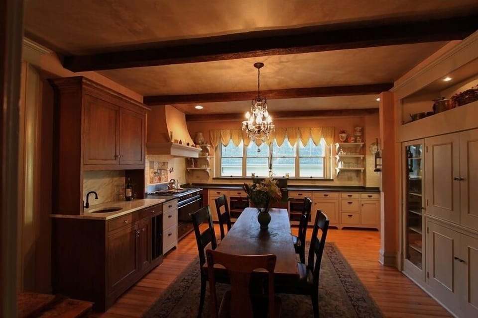 The heart of the home includes a LaCanche triple oven stove. Overlooks courtyard