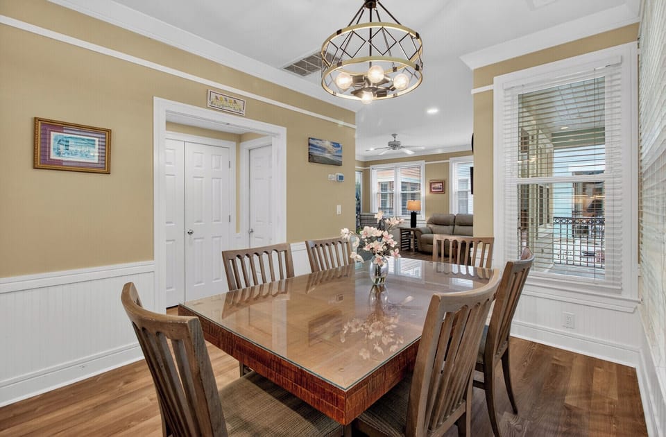 Gather around your elegant dining table for memorable meals under beautiful pendant lighting.
