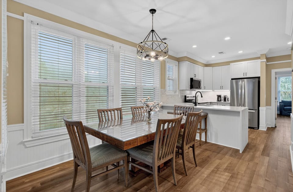 Your bright, modern kitchen flows seamlessly into the dining area, where you'll love hosting meals around the spacious table.