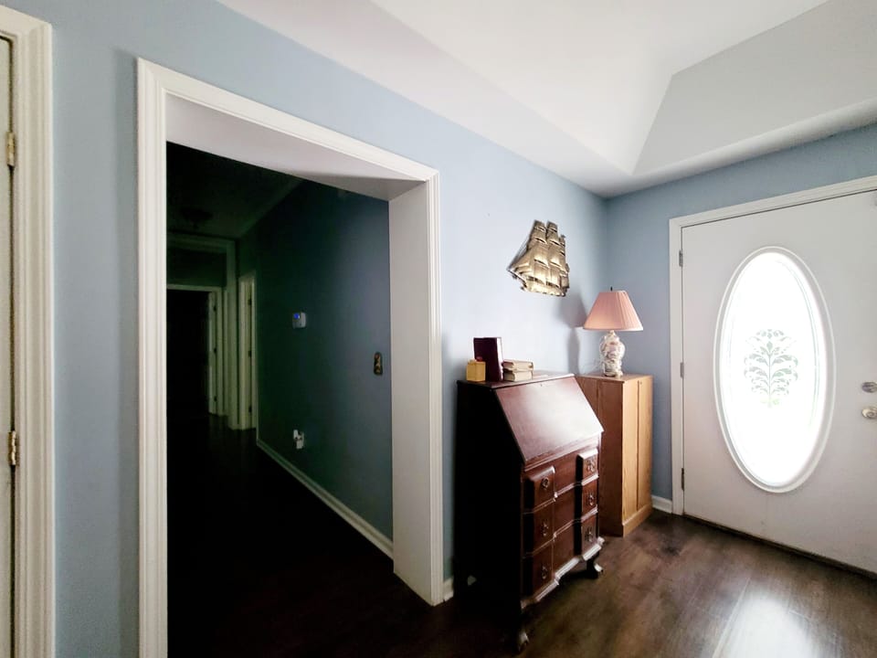 Entryway by Front Door and Adjacent Hallway