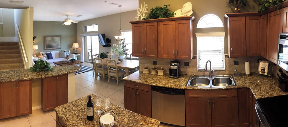 Modern Gourmet Kitchen Open & Inclusive with Main Room- Features Bartop Seating