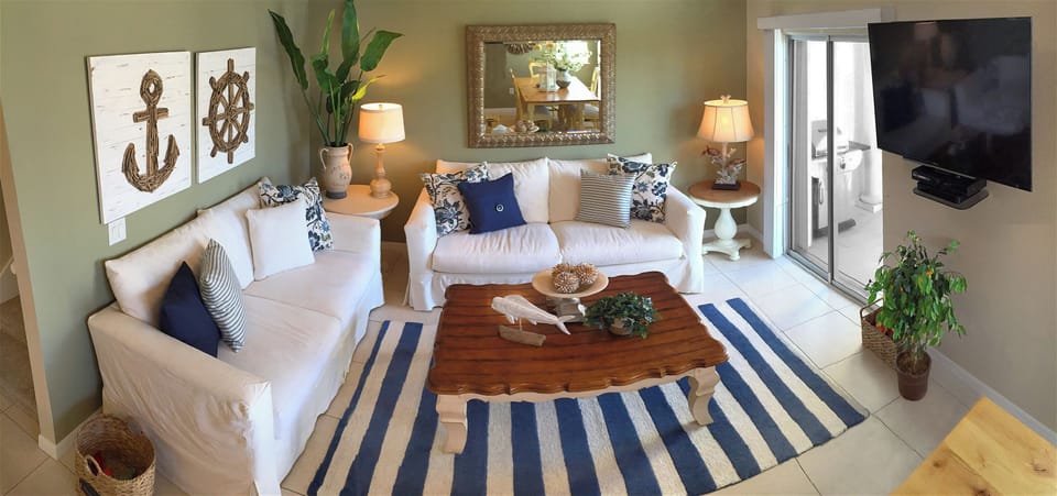 Living Room has South facing Balcony with indirect partial ocean view.