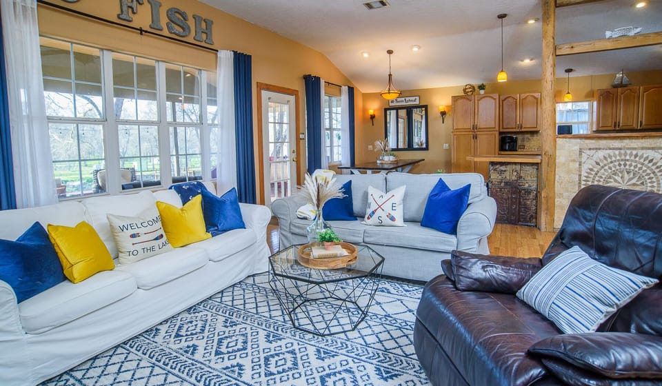 Living Room: Two Couches and a Recliner, Grey couch pull out to full bed.