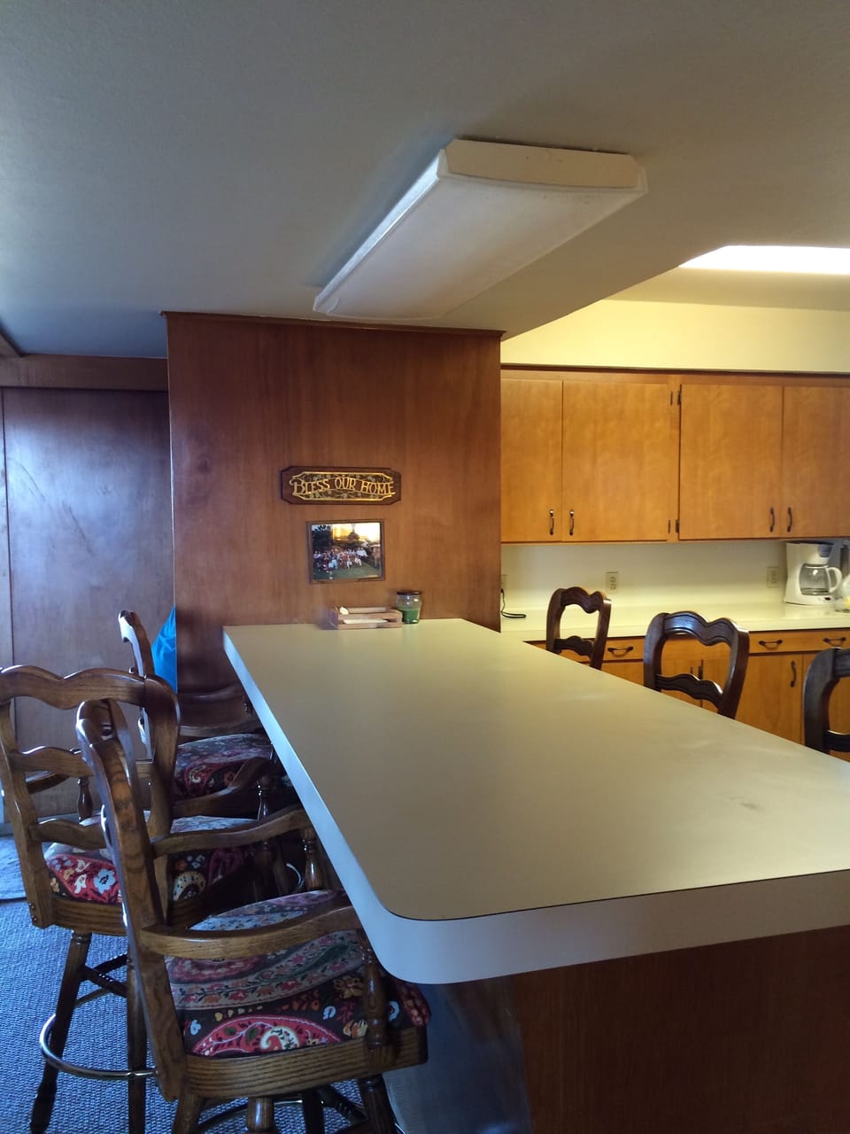 island bar between kitchen and den/dining area