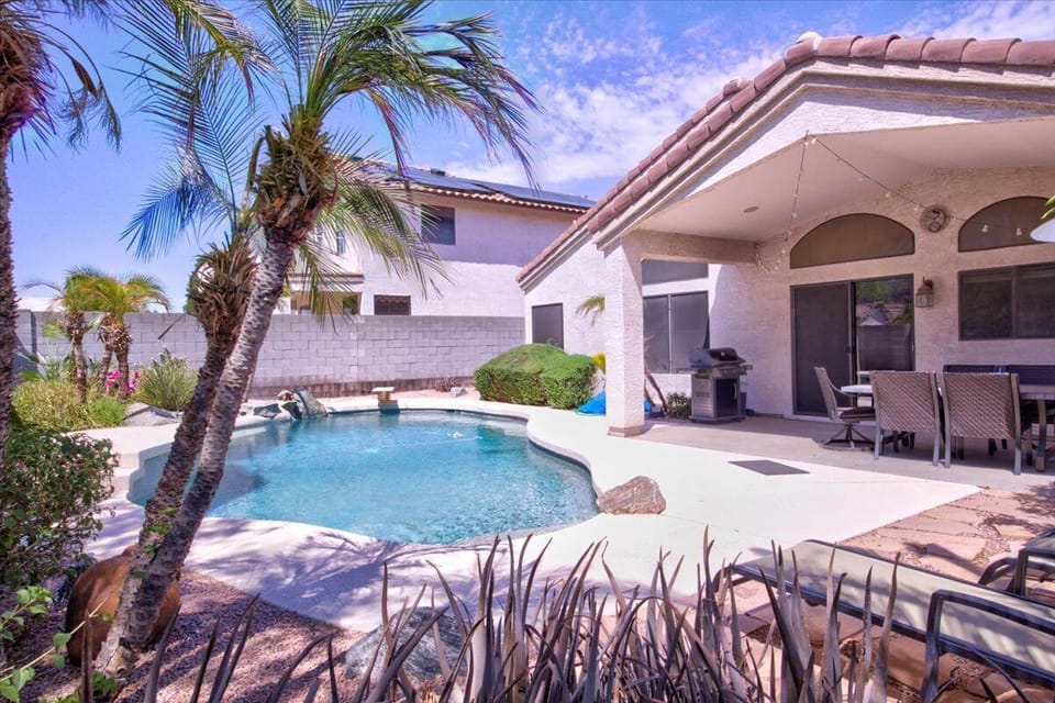 Backyard pool with a plethora of sun. Sunbather lounge chairs 
