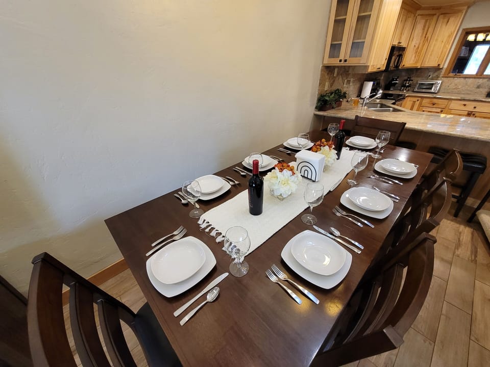 Dining table here set for 8 but could definitely seat 10.