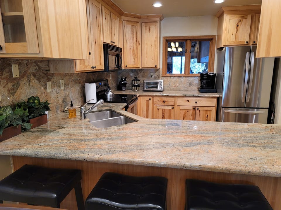 There are three stools at the breakfast bar as well.