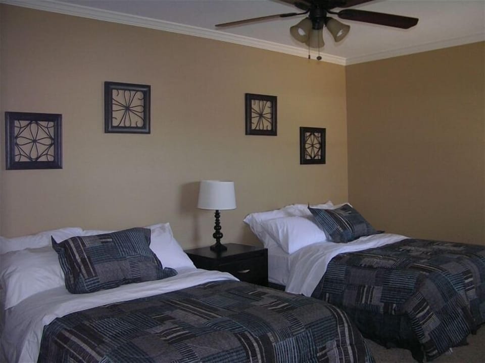 Lower level bedroom with 1 queen and 1full bed and view of lake.