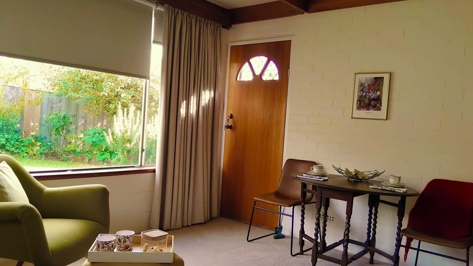 Wide picture window brings in garden views.