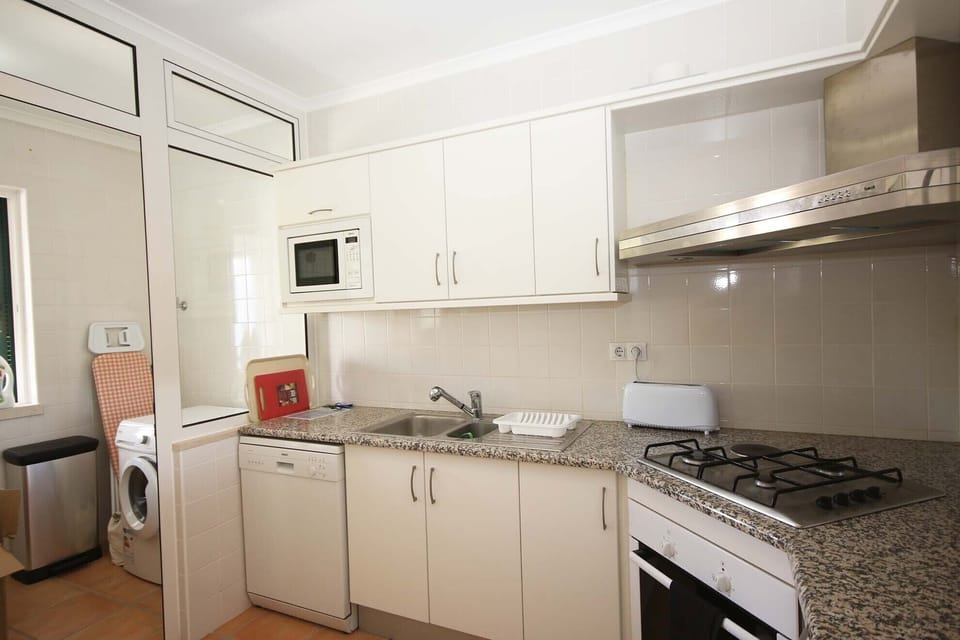 Kitchen leading onto utility