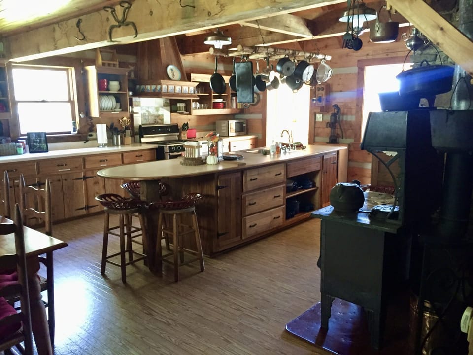 Kitchen island with seating and almost every appliance known to humankind