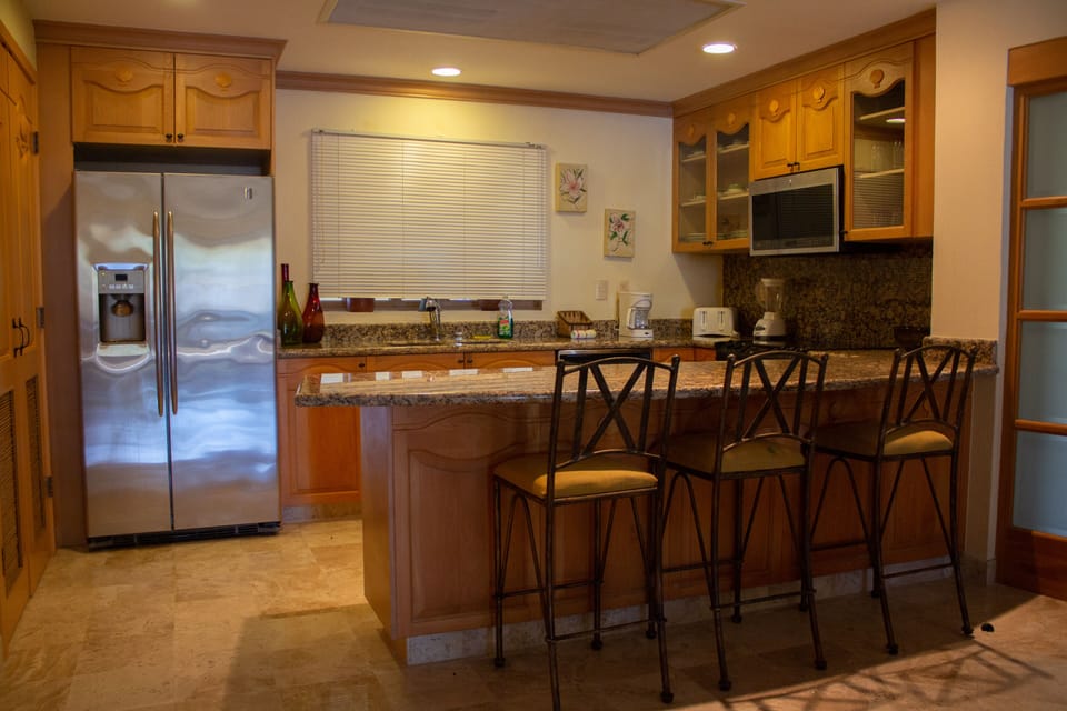 Large full kitchen with washer and dryer.