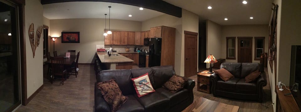 Pano of living, dinning and kitchen.  Kitchen has granite counter tops.
