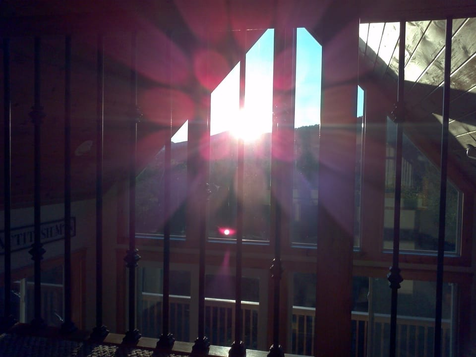 Summer sunrise from upstairs hallway