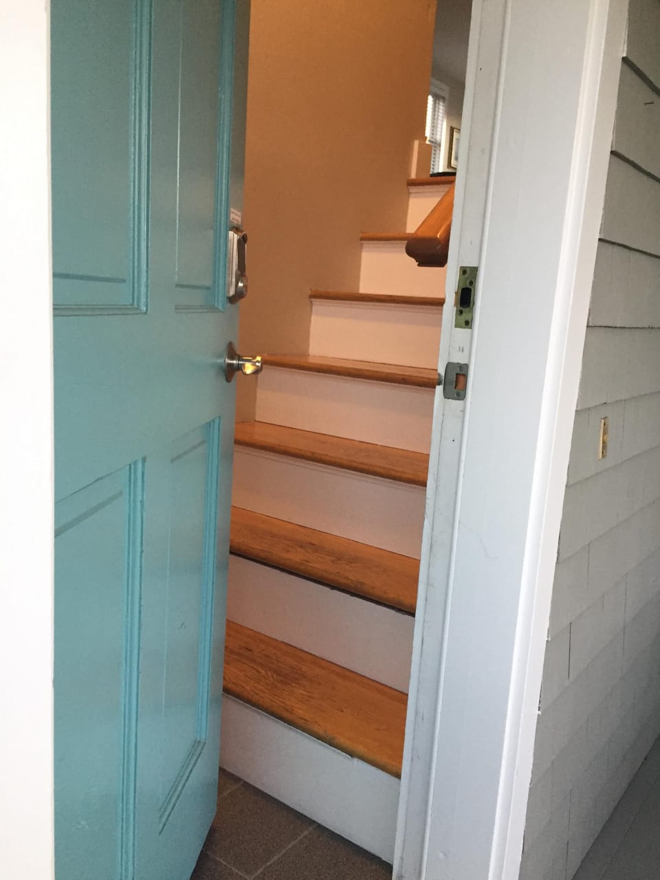 Step in the door and 7 stairs to the living/dining/kitchen/deck/bedroom/bath