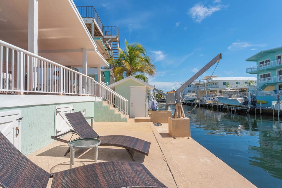 Canalside loungers for sunbathing and boat views. No lift