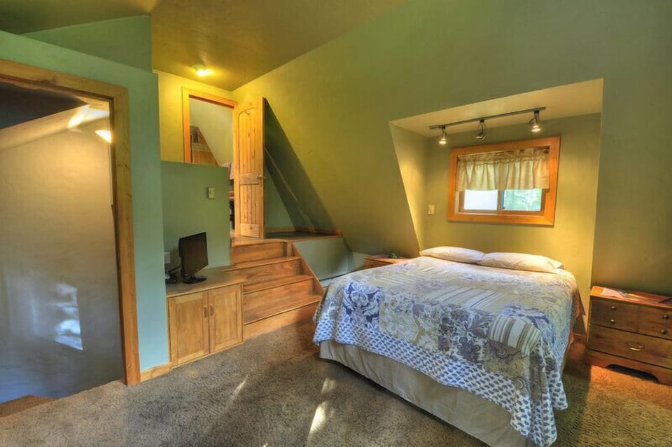 Master bedroom with steps to master bath.