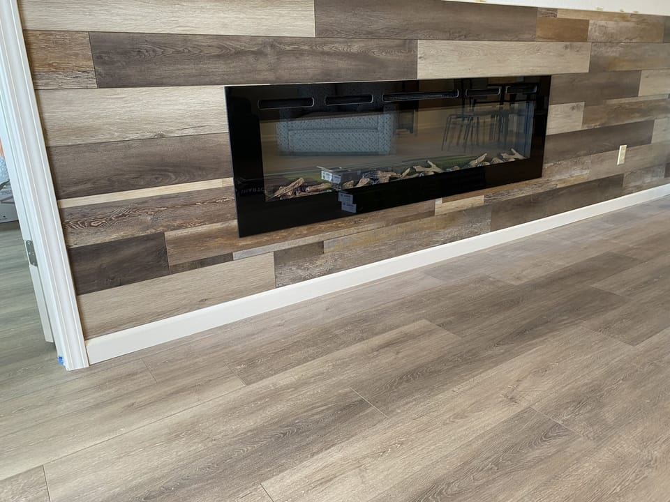 Accent wall in living room with electric fireplace