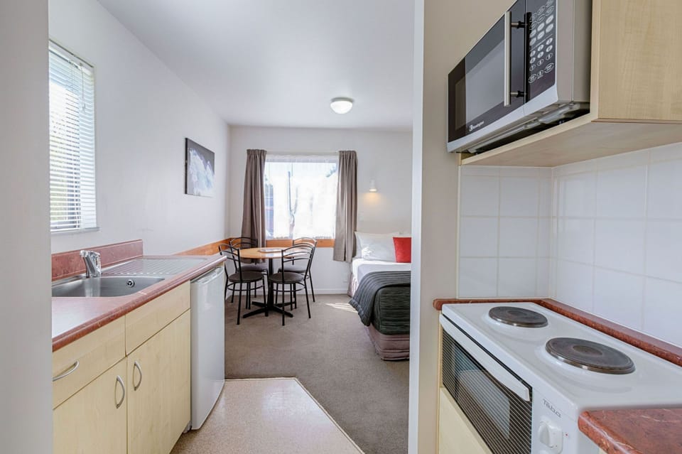 One Bedroom Unit | Private kitchen | Fridge, microwave, coffee/tea maker, electric kettle
