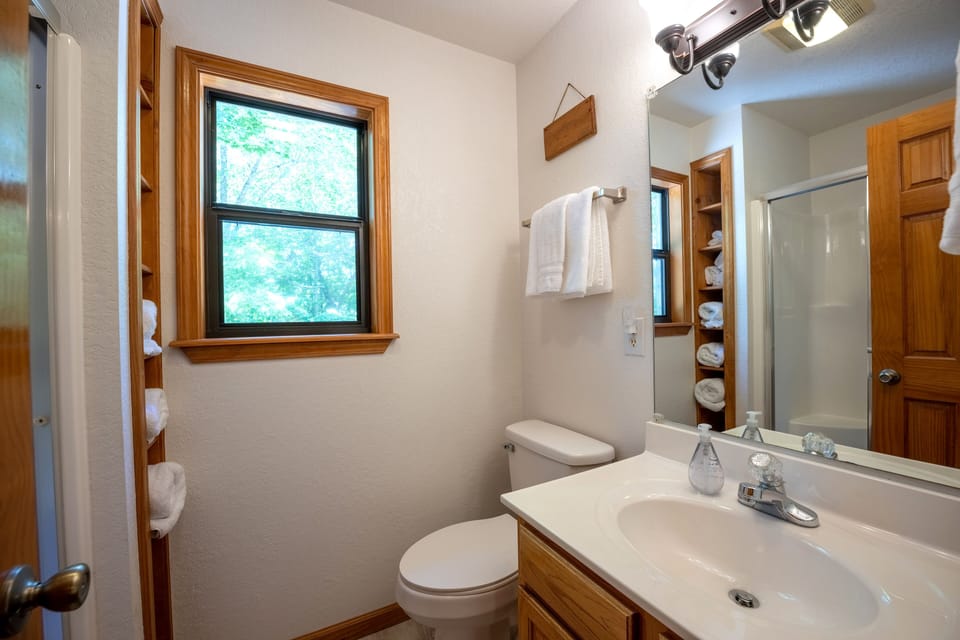 Upstairs loft area bathroom with shower.