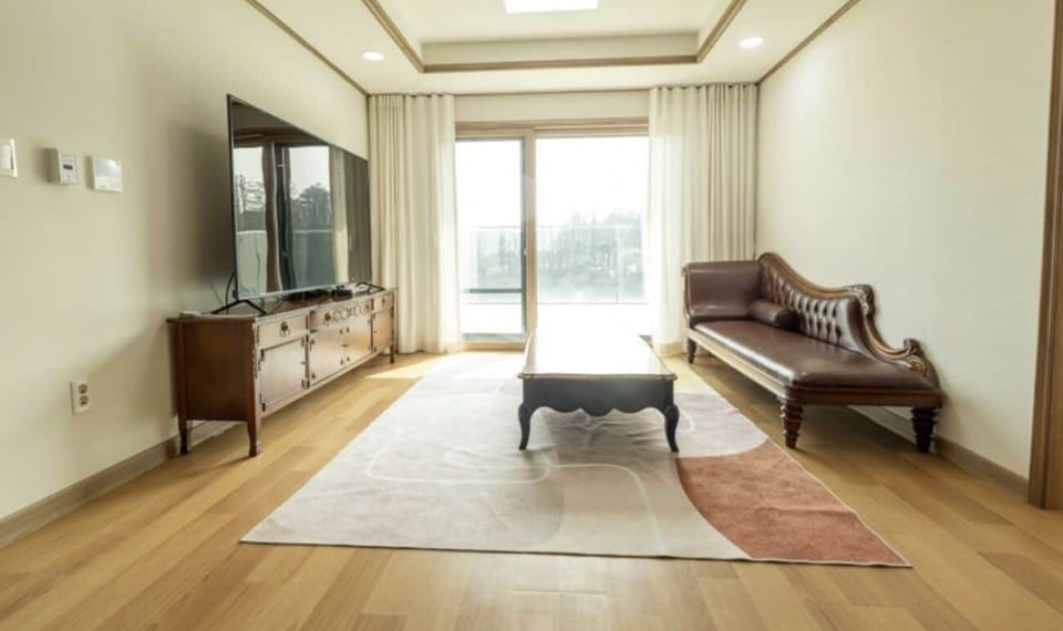 Residential Suite | Living area | 75-inch flat-screen TV with cable channels, TV