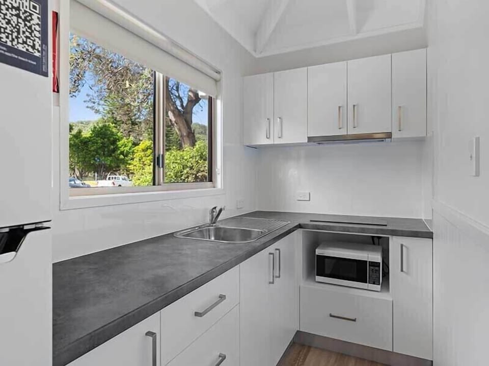 Full-size fridge, microwave, stovetop, electric kettle