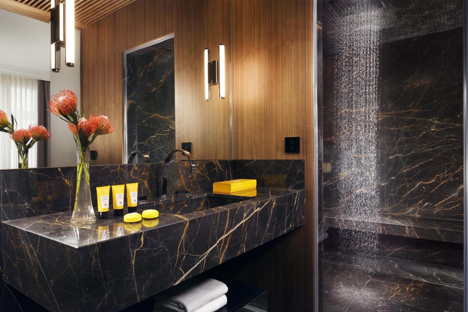 Designer toiletries, hair dryer, bathrobes, slippers