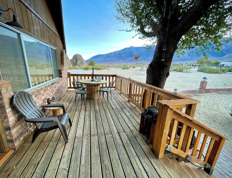 Large front porch has plenty of lounging areas, barbecue and views of Mt Whitney