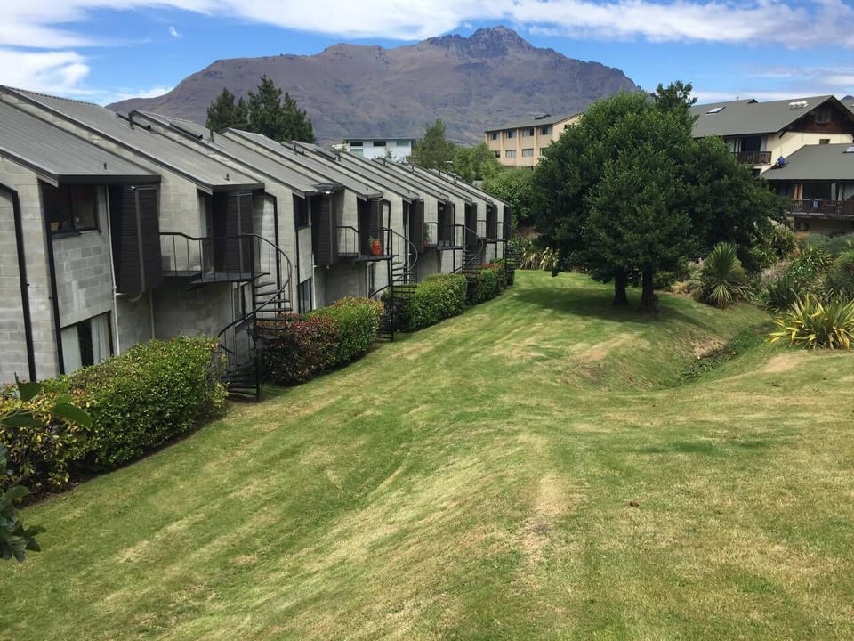 Exterior: Stunning hillside views and lush grounds invite you to relax and unwind in nature! Rear area of Townhouses